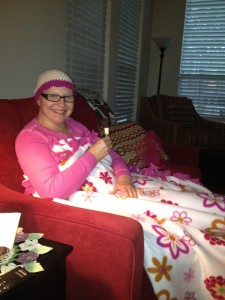 Enjoying my knitted cap and handmade blanket, given by charities to MD Anderson patients.